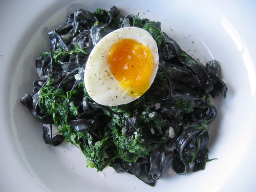 Black tagliatelle with spinach and egg