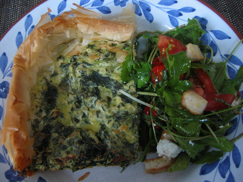 Filo pastry with spinach, rape leaves and ricotta, rucola tomato salad
